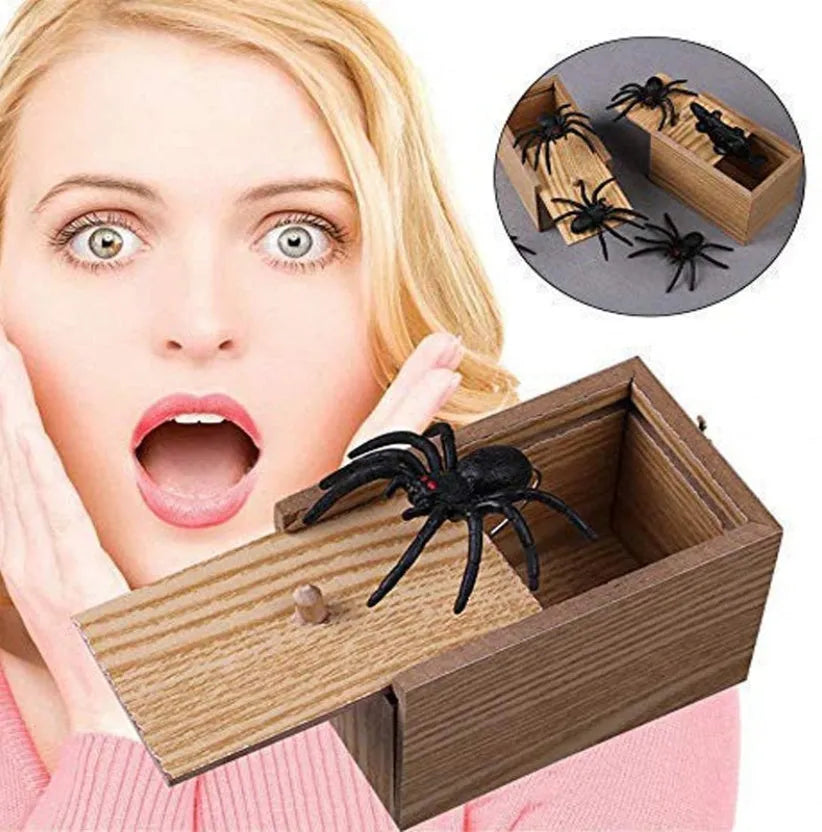 A closed wooden prank scare box measuring 9.1 cm, with a random lifelike animal inside ready to jump out.