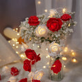 LED rose fairy lights with battery pack showing pink foam rose-shaped covers on 1.5 metre cable