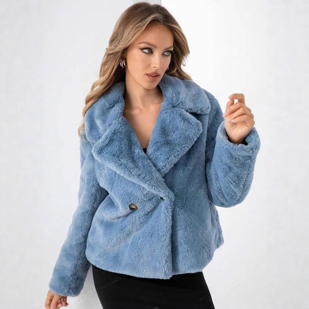 Short loose-fitting women's faux fur coat in rose red on a model.