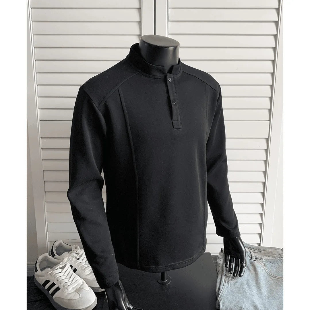 Men's grey asymmetric polo shirt with a patchwork stand-up collar and long sleeves.