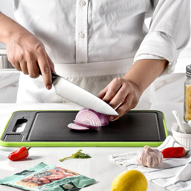 Grey square aluminium cutting board with double-sided design showing cutting surface and grinding teeth
