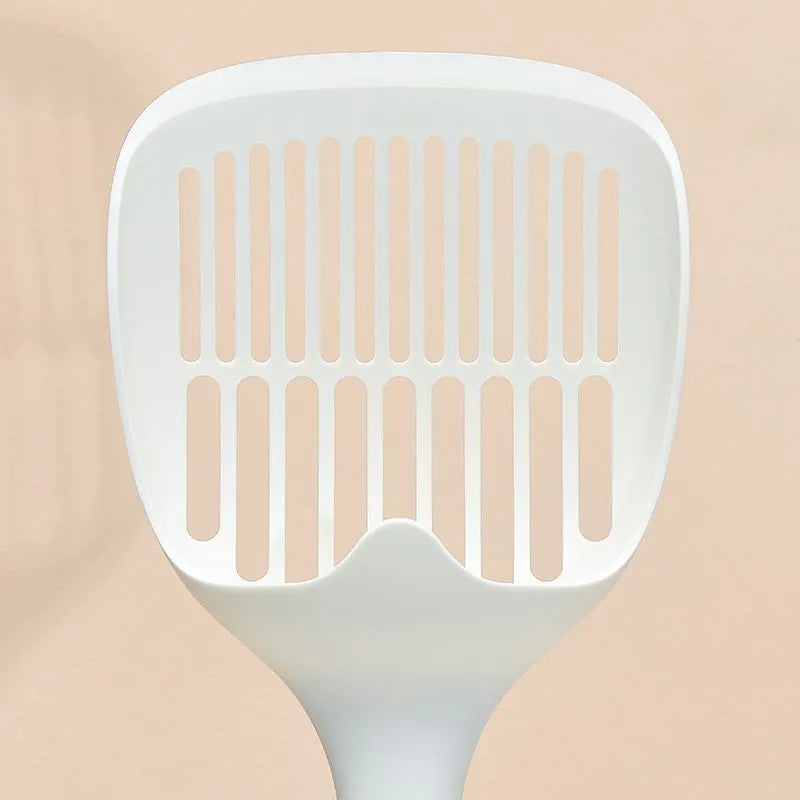 White plastic cat litter scoop with a storage base, shown with dimensions 29.5cm by 12.8cm.