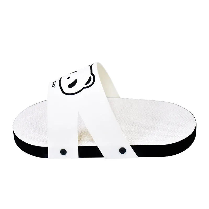 White slipper-style corrugated paper cat scratch board on a floor.