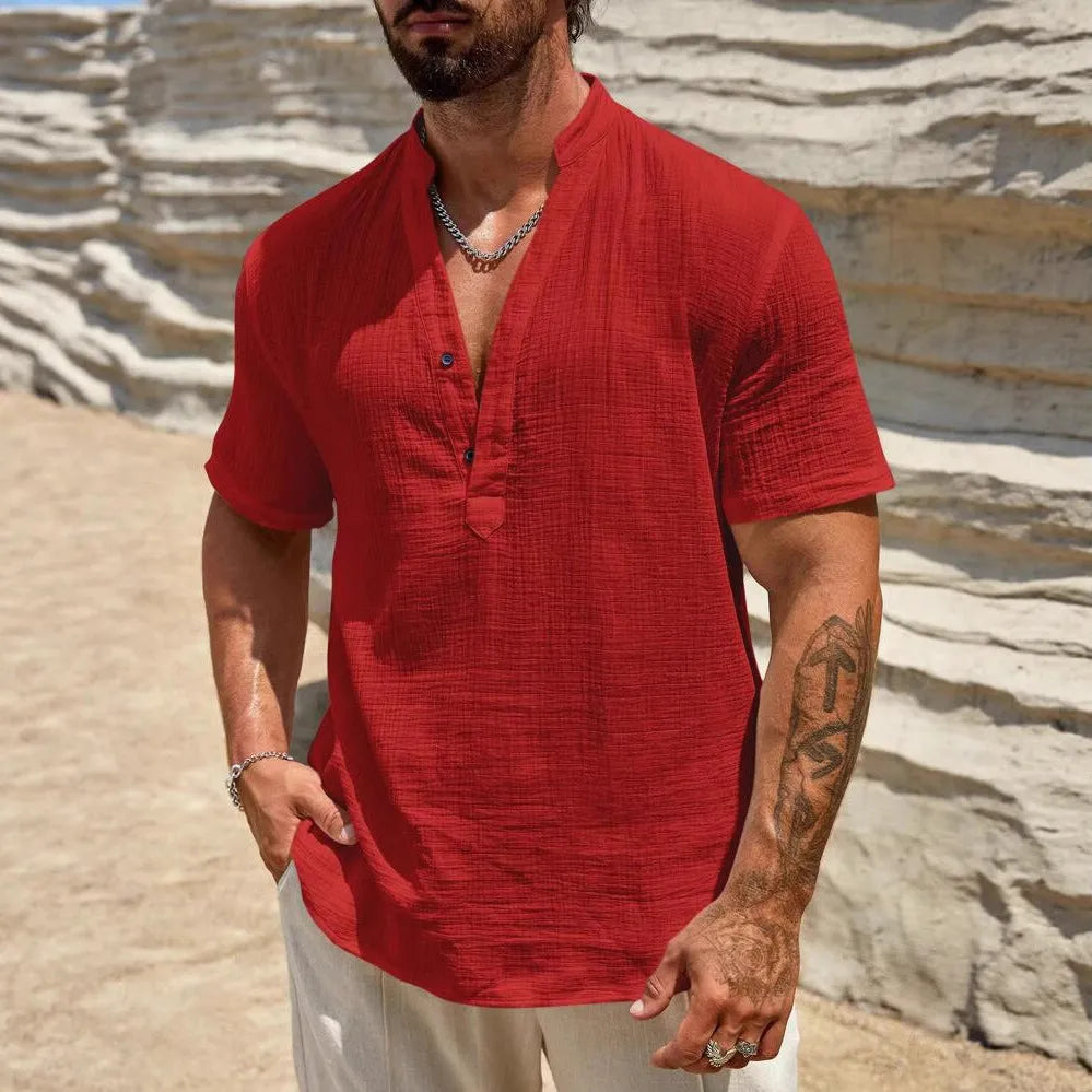 Men's solid colour stand collar short-sleeved casual shirt laid flat, showing thin fabric and slit detail.
