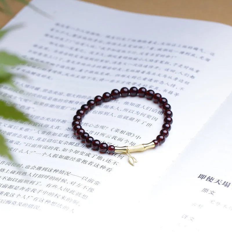 Single ring bamboo joint bracelet with 6mm natural garnet bead in copper or silver finish