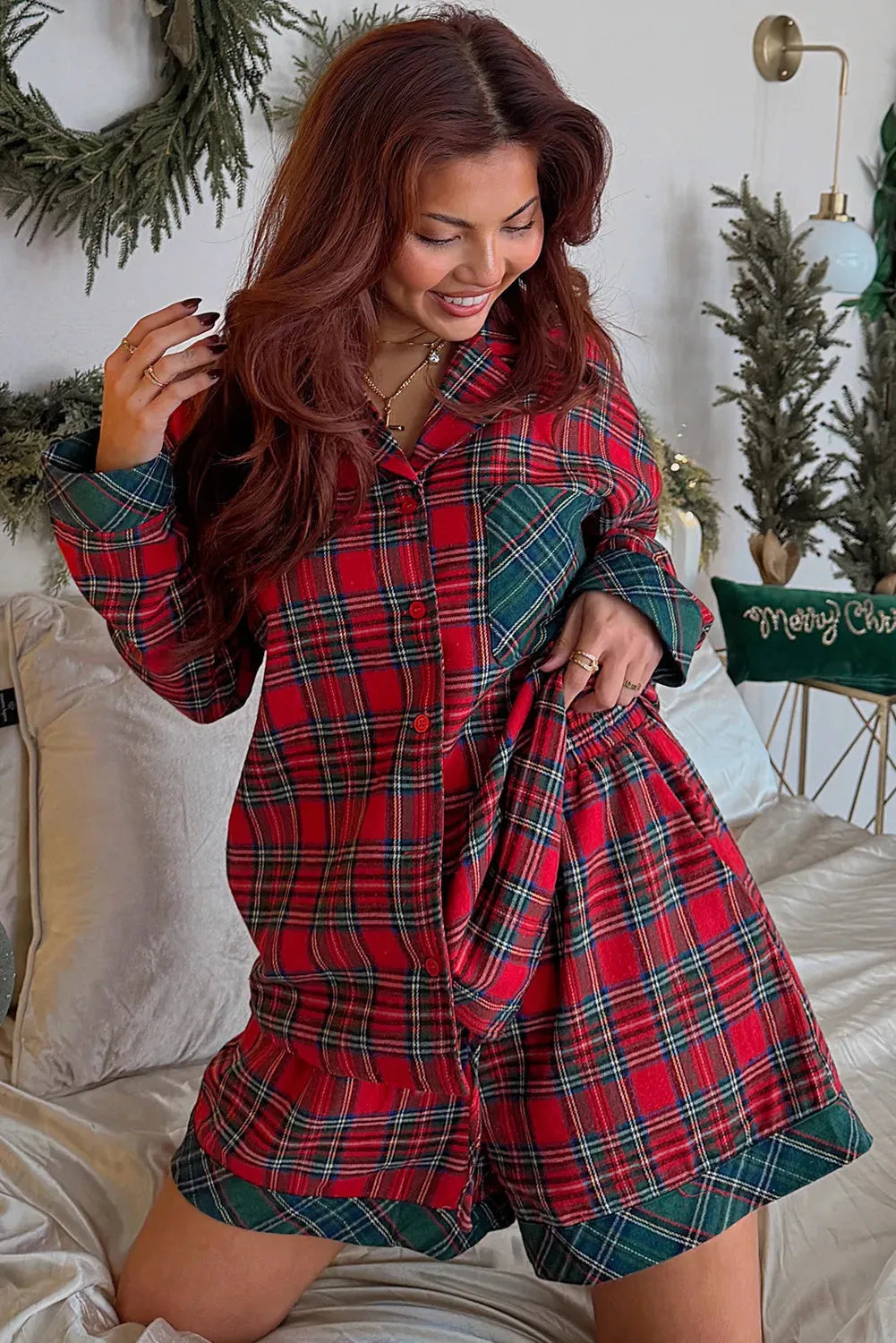 Red plaid Christmas pyjama set with long sleeve shirt and shorts.