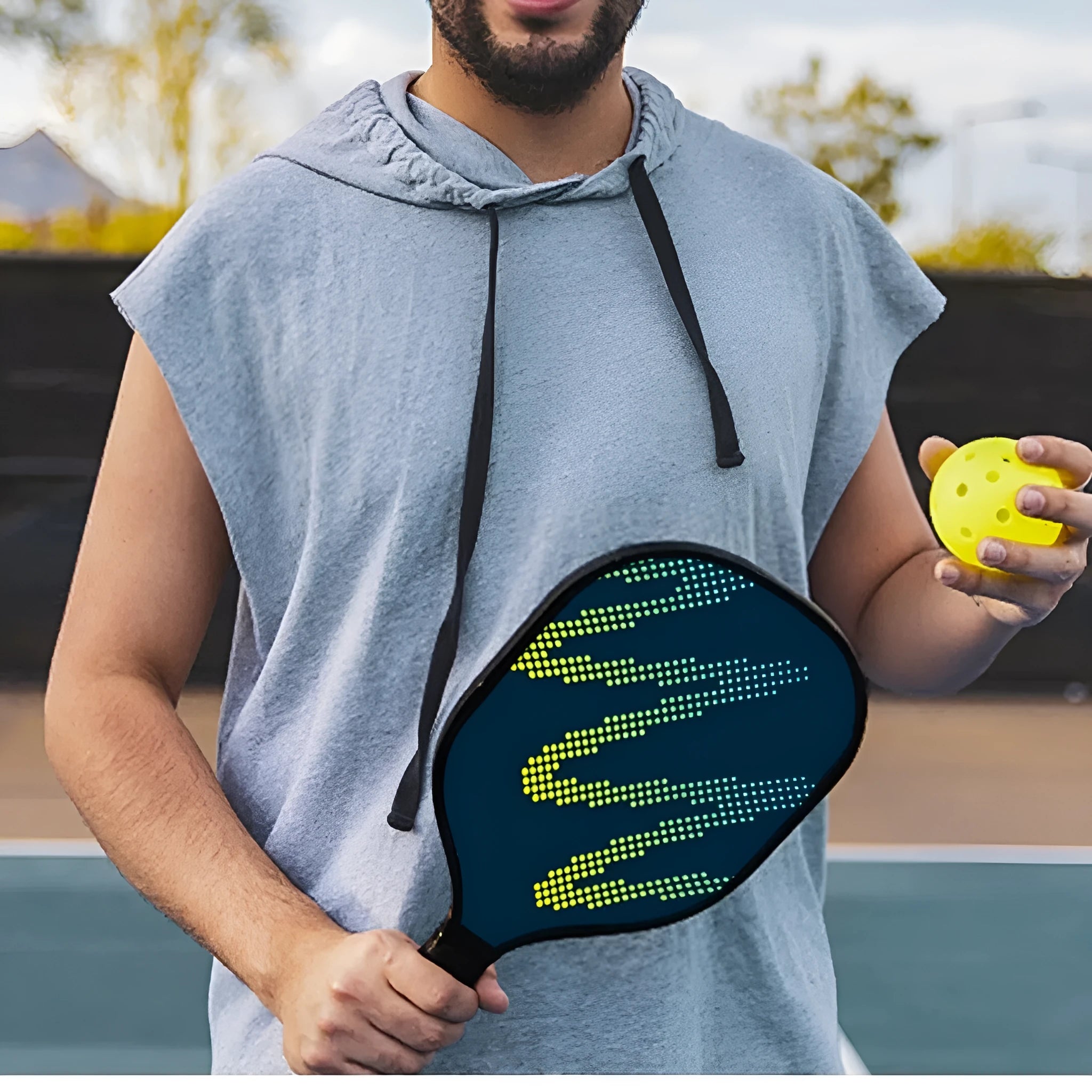 A high-density fibreglass outdoor table tennis racket with a classic paddle shape on a plain background.