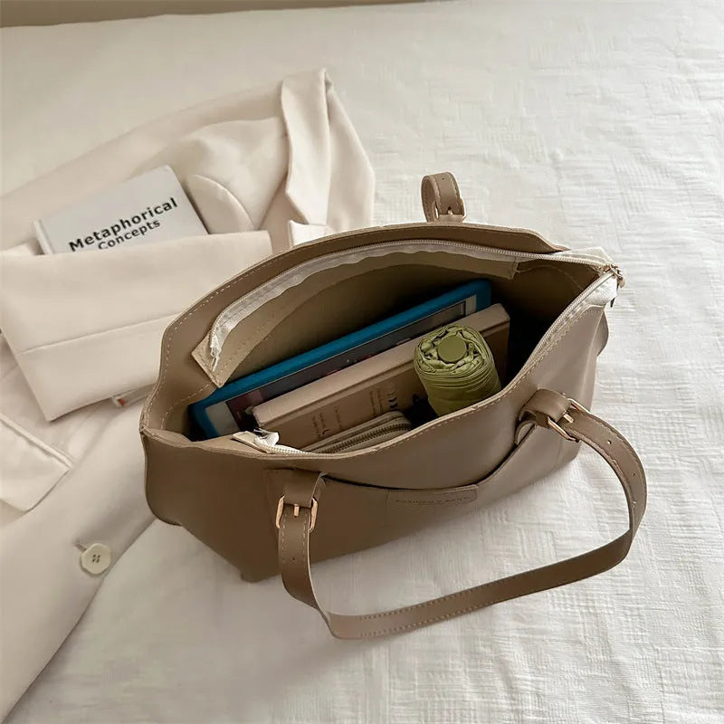 Women's structured PU tote bag in neutral colour with phone pocket and double shoulder straps.