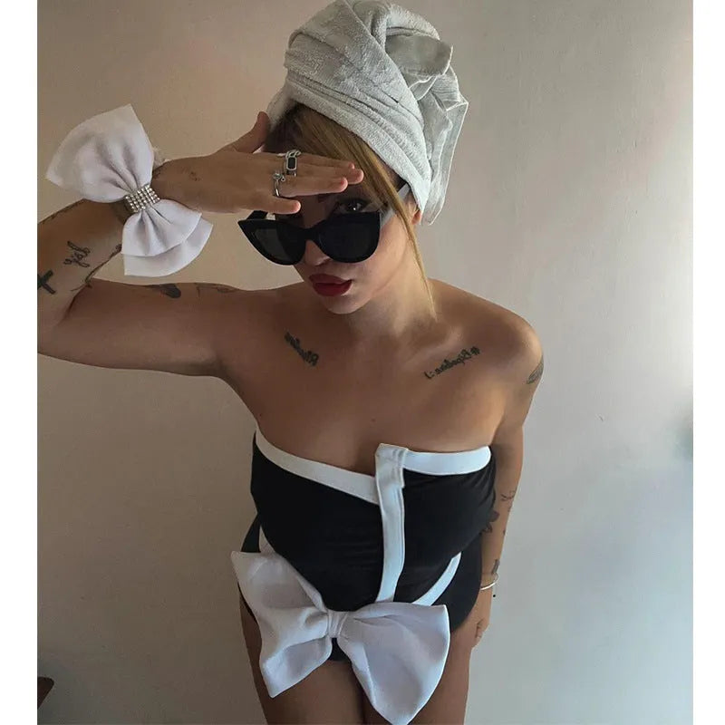 Women's black and white colour-block one-piece swimsuit with bow detail and tube top neckline