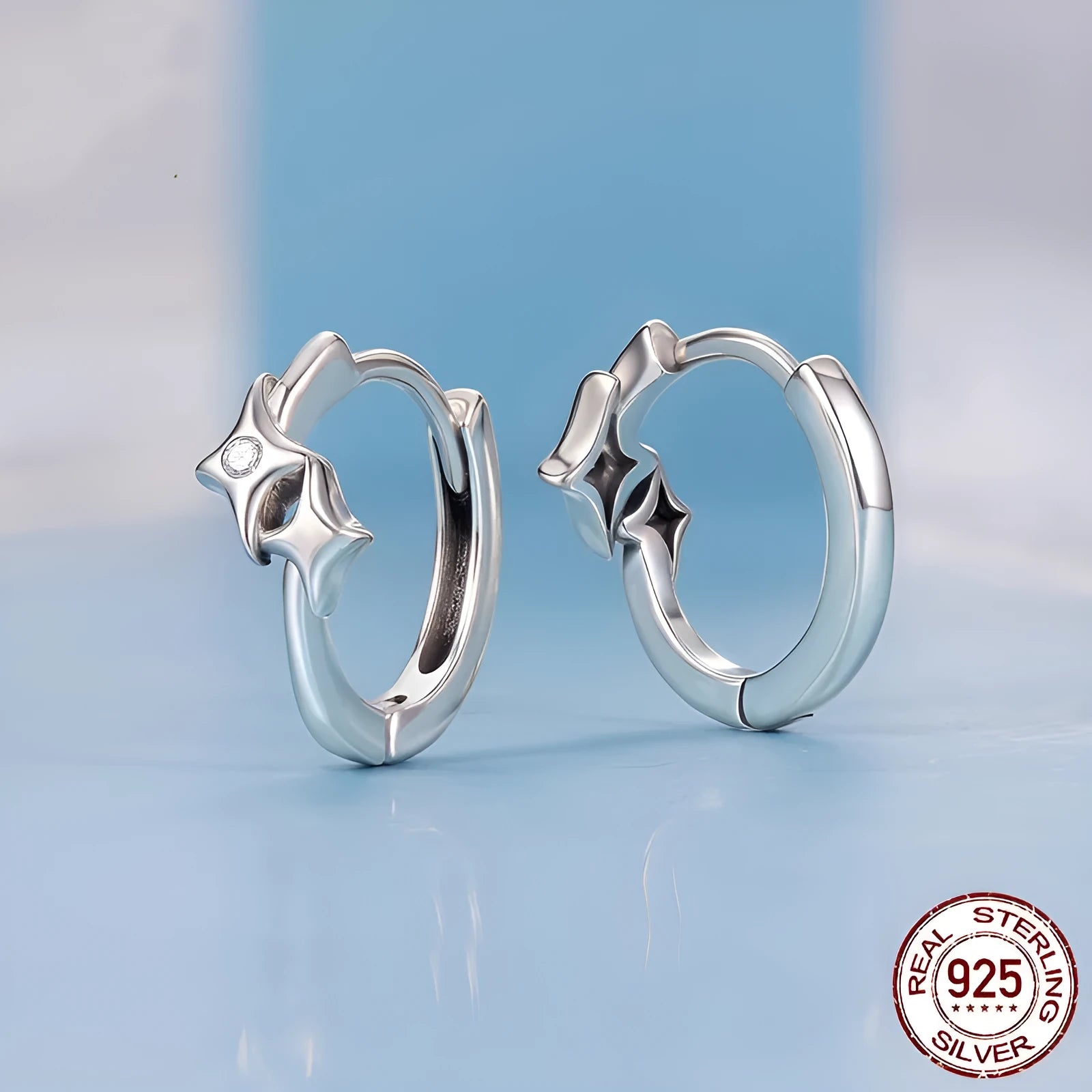 Fashion Star S925 sterling silver earrings with inlaid zircon, colour BSE1210, on display