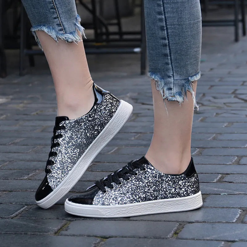 Women's black sequinned lace-up casual shoes with a round toe and rubber sole, shown from the side.