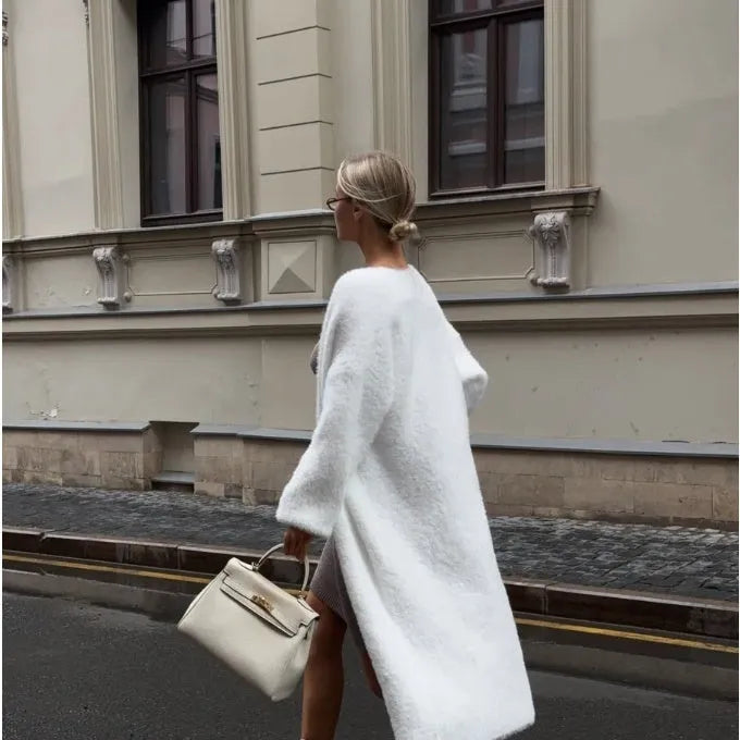 Long white women's cardigan jacket with thick knit and open front.