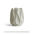 Irregular ceramic vase with artistic form for flower arrangements in magnesium clay construction