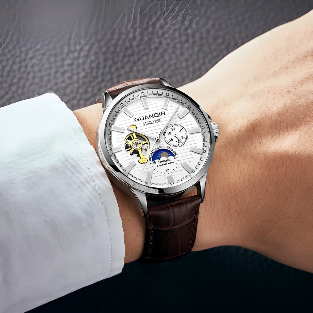 Men's automatic skeleton mechanical watch with 42mm dial, genuine leather strap, and sapphire crystal glass