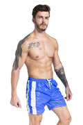 Blue men's slim-fit sports shorts with lace-up sides and built-in padding on a white background.