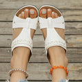 Women's blue roman style slipper with slope heel and fish mouth toe on a white background