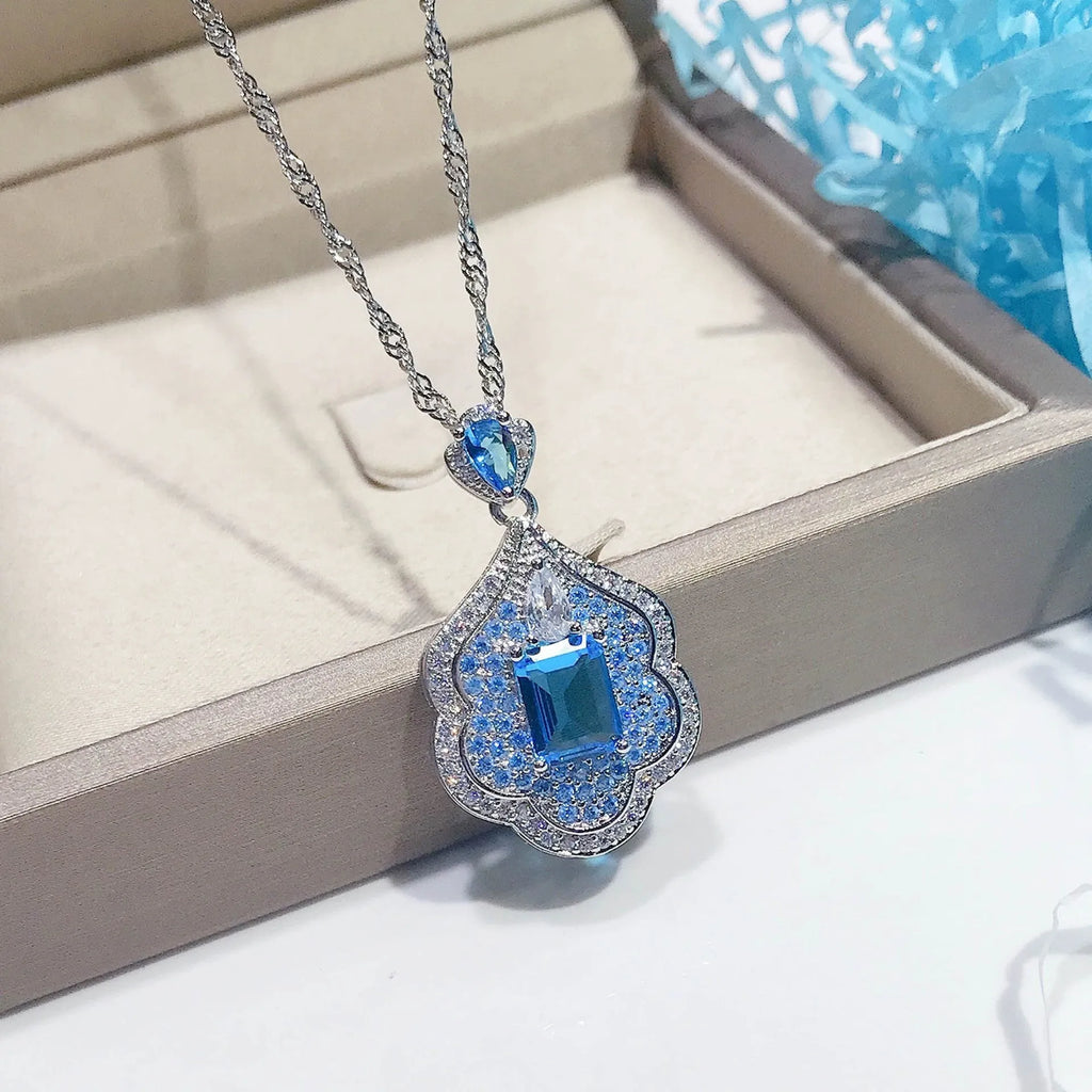 Sea blue copper geometry sky mirror pendant on plain background