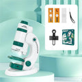 White and green portable microscope kit with specimen slides for outdoor educational use