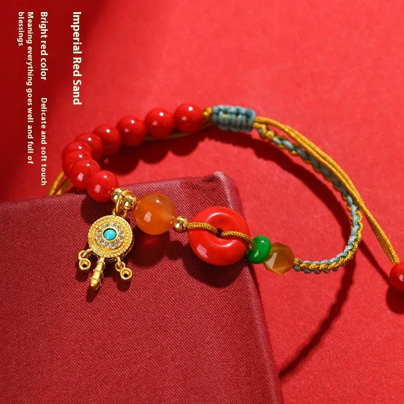 Hand-woven cinnabar peace blessing bracelet with buckle closure in emperor red sand colour