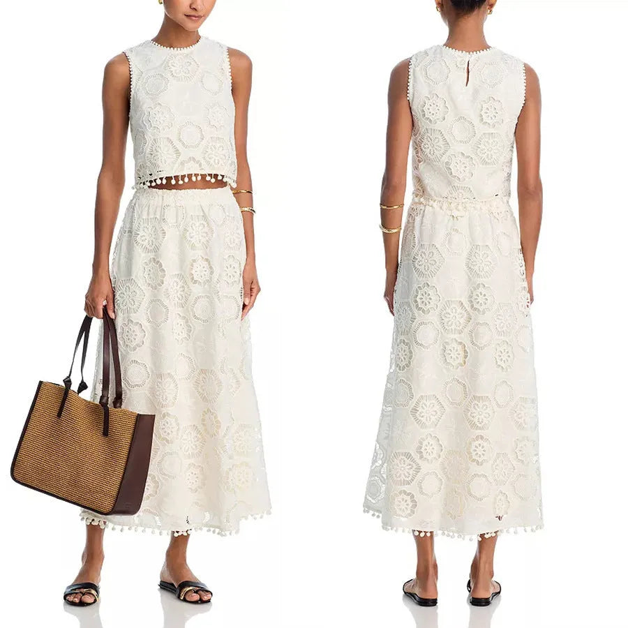 White women's retro style sleeveless top and long skirt suit set with embroidery detail.