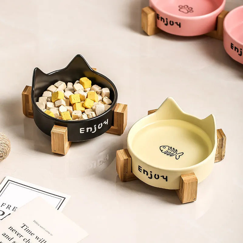 Porcelain cat food and water bowl set with wooden anti-slide frame in a choice of colours and patterns.