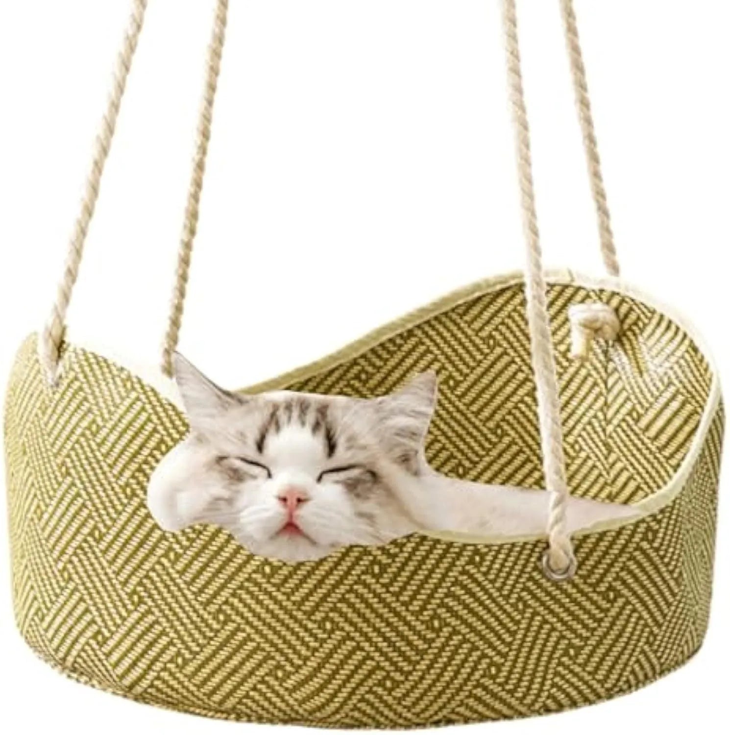 Green rattan cat hammock with metal hooks hanging on a white fence, a cat lounging inside.