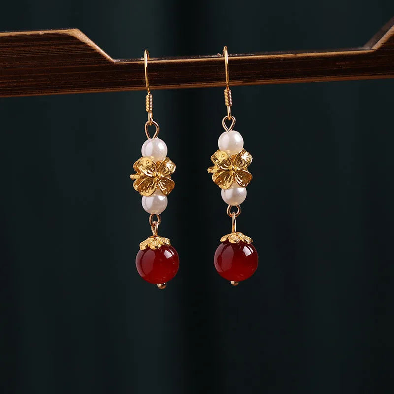 National Han Cheongsam antique earrings in geometric drop design with gold tone electroplated finish.