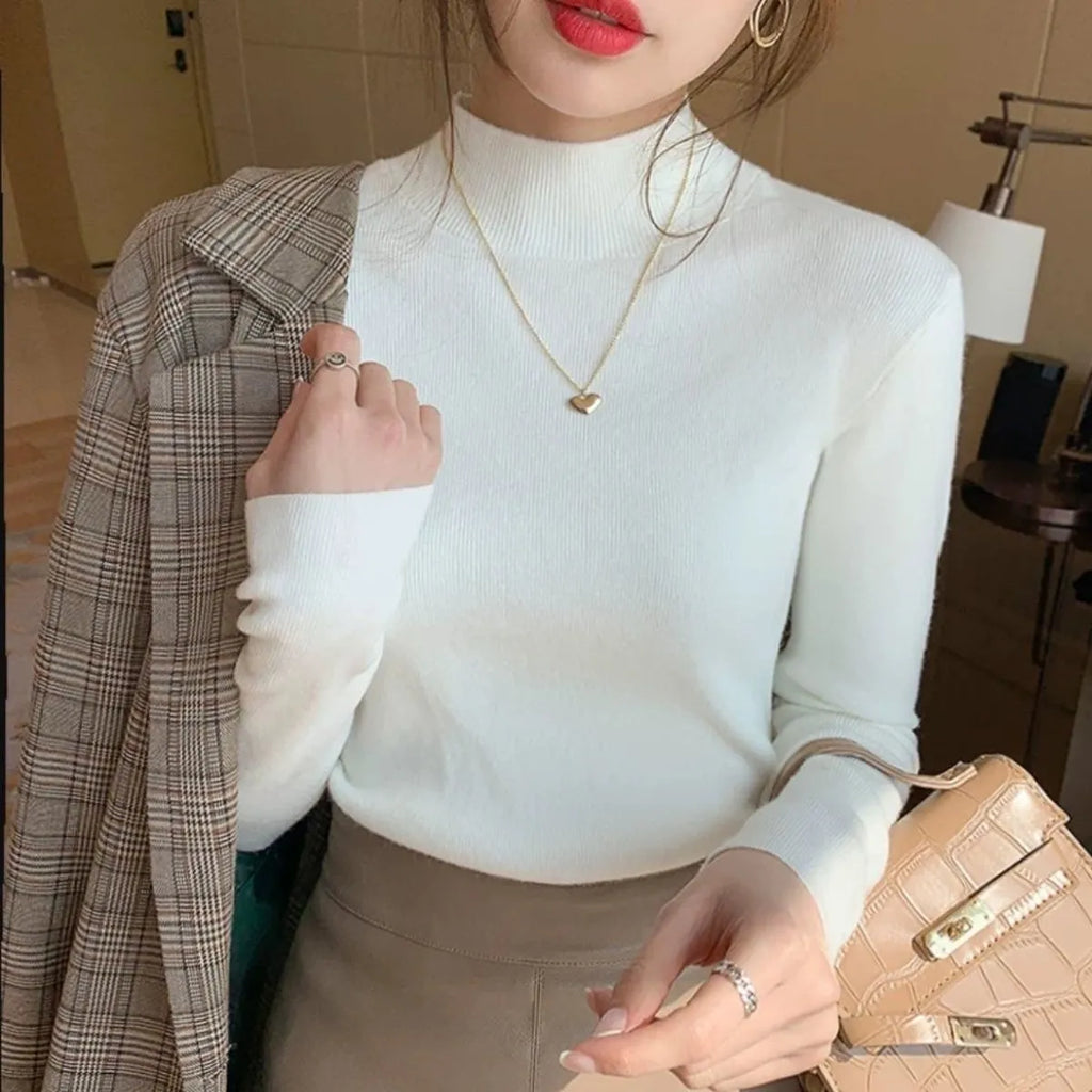 Slim fit long sleeve viscose top in apricot colour on a hanger