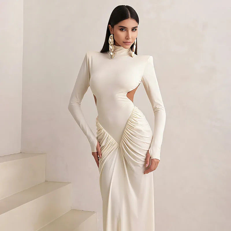 Women's slim fit long sleeve dress with high collar and pleated backless detail in apricot colour.