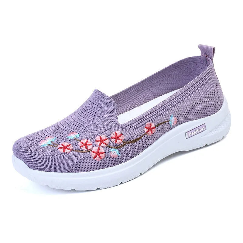 Women's wine red embroidered floral woven pumps with a flat anti-slip sole.