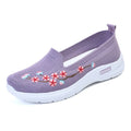 Women's wine red embroidered floral woven pumps with a flat anti-slip sole.