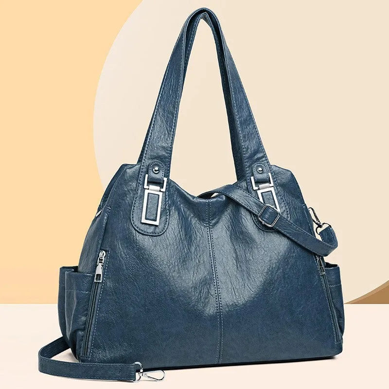 Soft PU women's tote bag in square vertical model with single shoulder strap showing internal organisational pockets