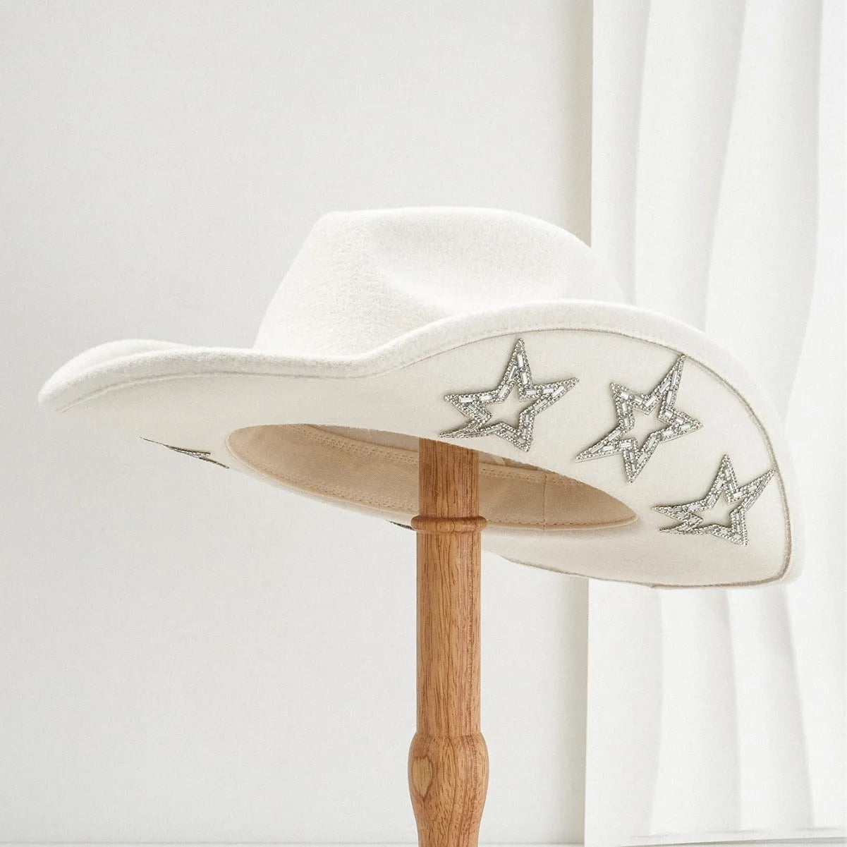 Polyester felt Western-style conical top hat with hexagonal star decoration in beige.