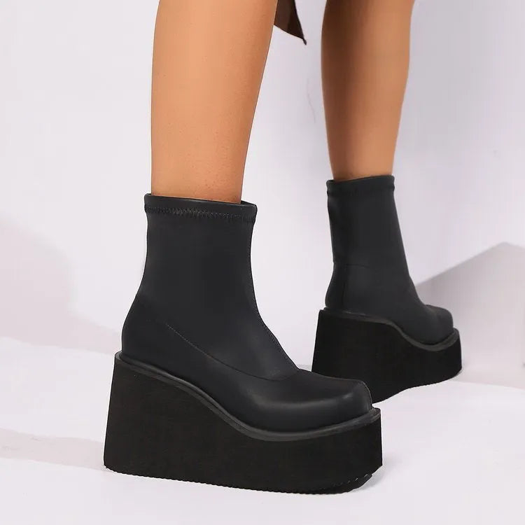 Women's plus size black wedge heel boots with waterproof platform and round toe design