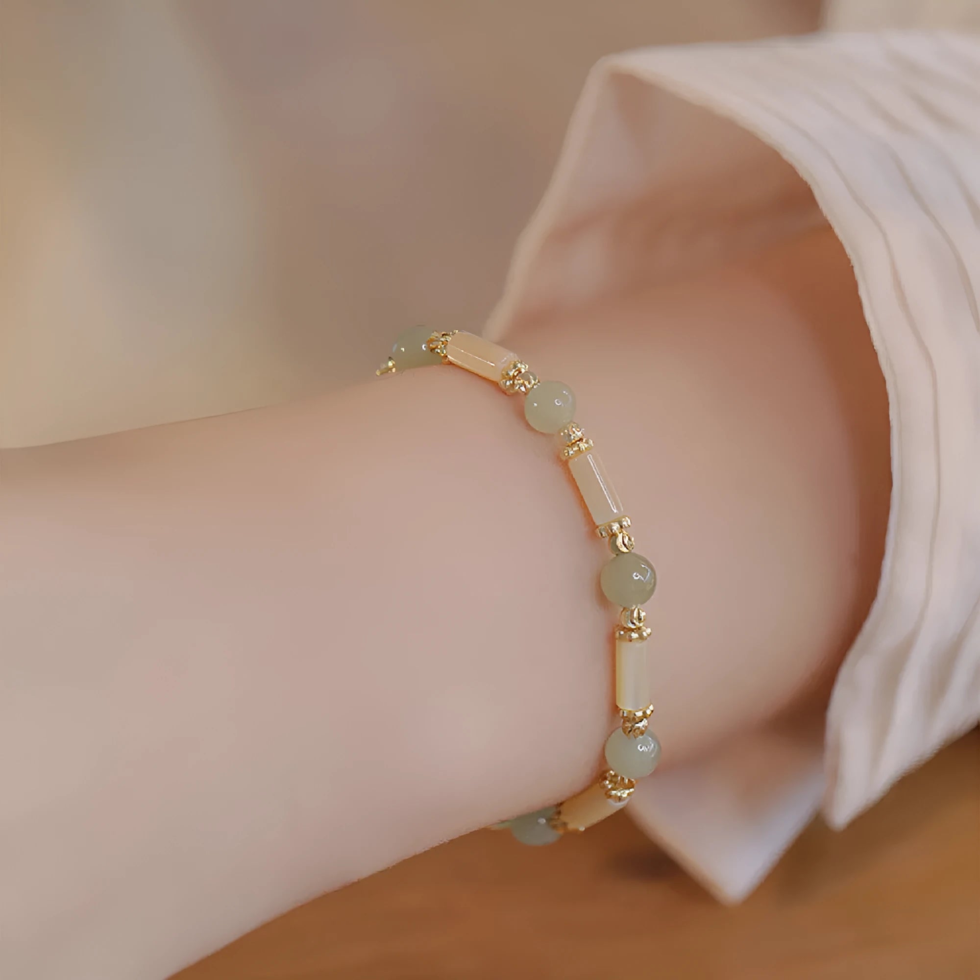 Women's bamboo design bracelet with 6mm Hetian jade beads in either jade or South Red colour.
