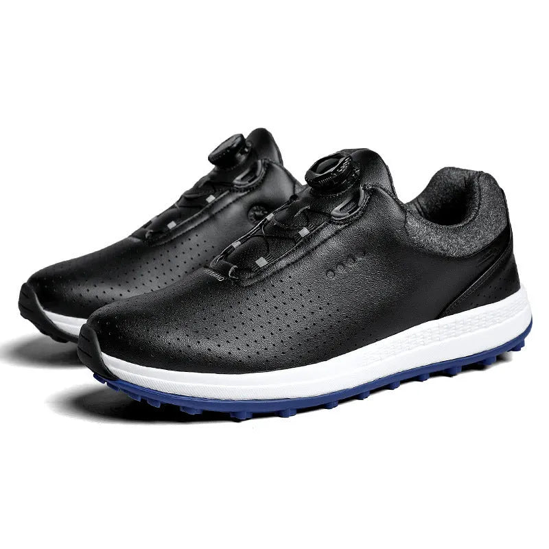 Men's white and black casual low-top golf shoes with breathable hollow-out design and non-slip sole.