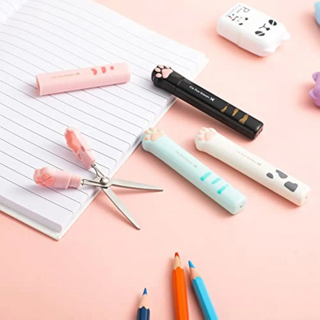 Cat paw cartoon design mini folding safety scissors in four colours: black, blue, pink, and white.