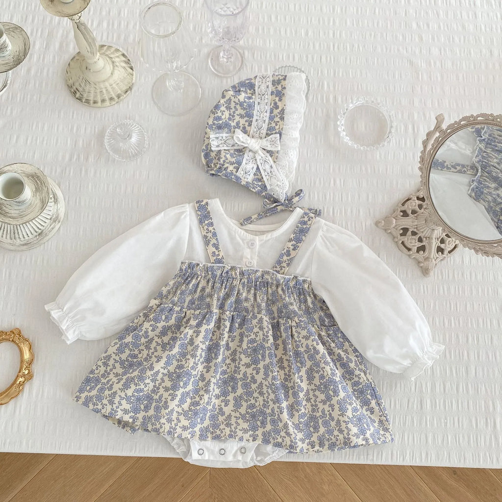 White cotton baby girl floral princess fake two triangle romper with removable hood, long sleeves, front view
