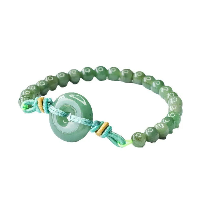 Natural emerald jade bracelet with star-shaped beads and a silver safety buckle.