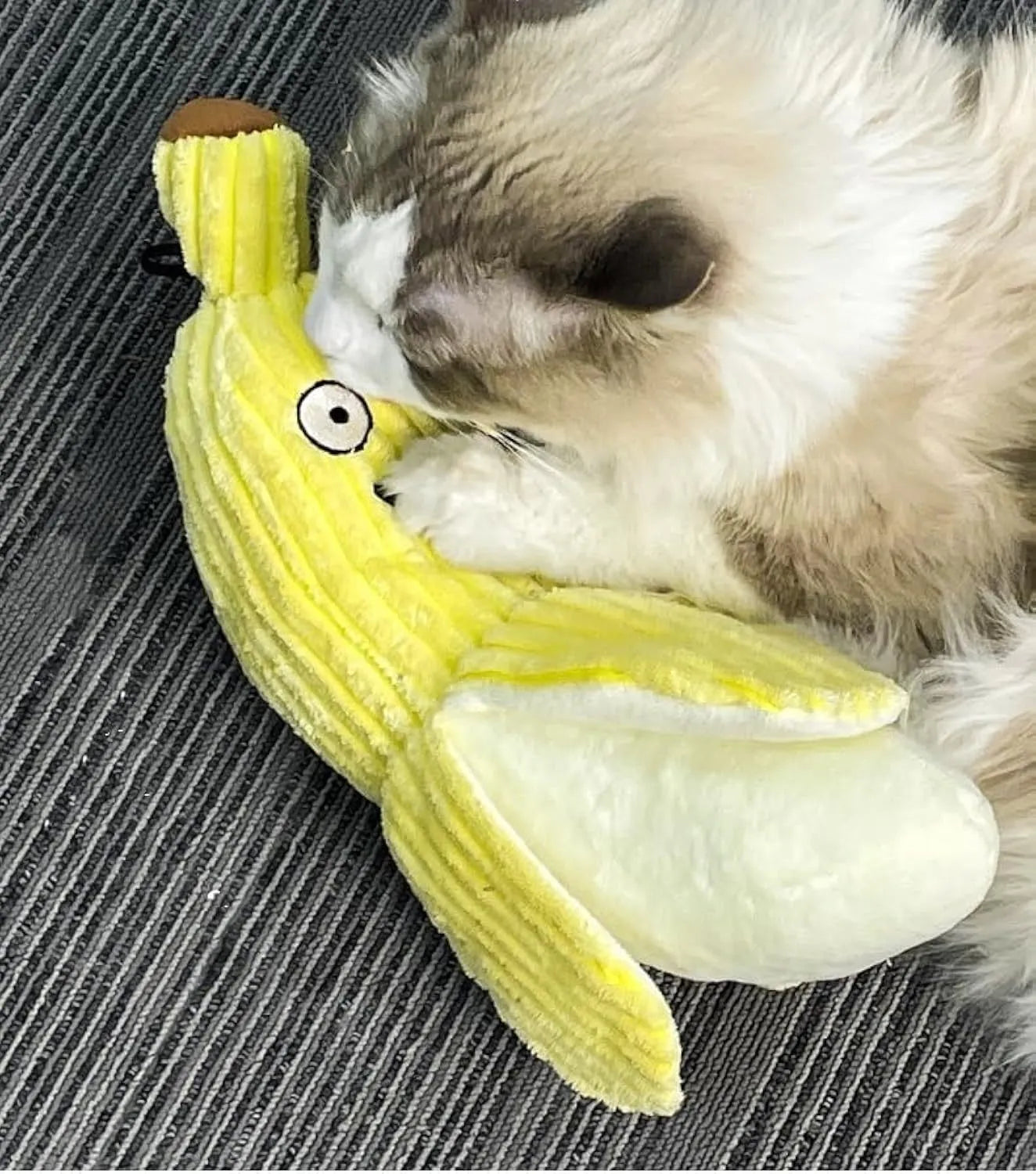 Yellow banana-shaped cat toy with crinkle sound element for interactive feline play