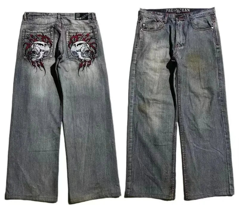 Gray washed-out denim jeans on a man, showing straight wide-leg cut and vintage workwear style.