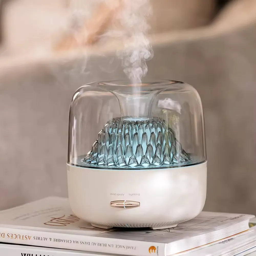 Beige resin round desktop aroma diffuser with colourful light on a wooden nightstand