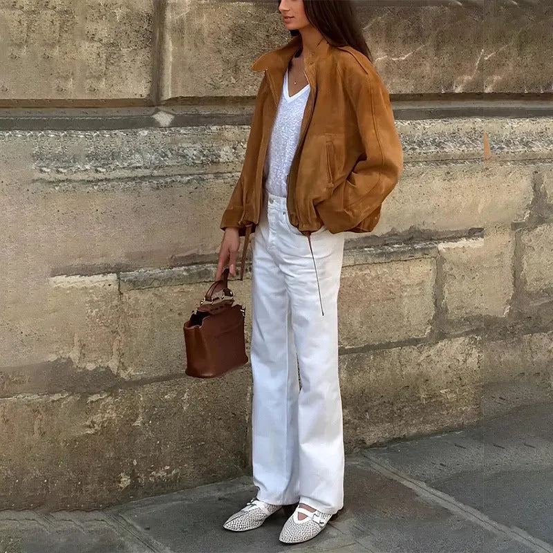 Man wearing a solid colour retro loose-fit polyester jacket.