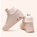 Women's fleece-lined snow boots with thick air-cushion sole, anti-slip design, mesh upper, front lacing, chain detail, low platform heel, in white, khaki, or black.