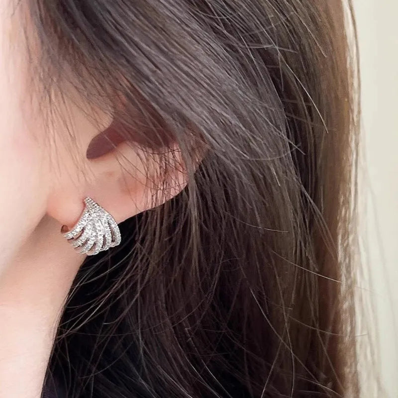 Geometric zircon earrings with platinum electroplated finish and line design