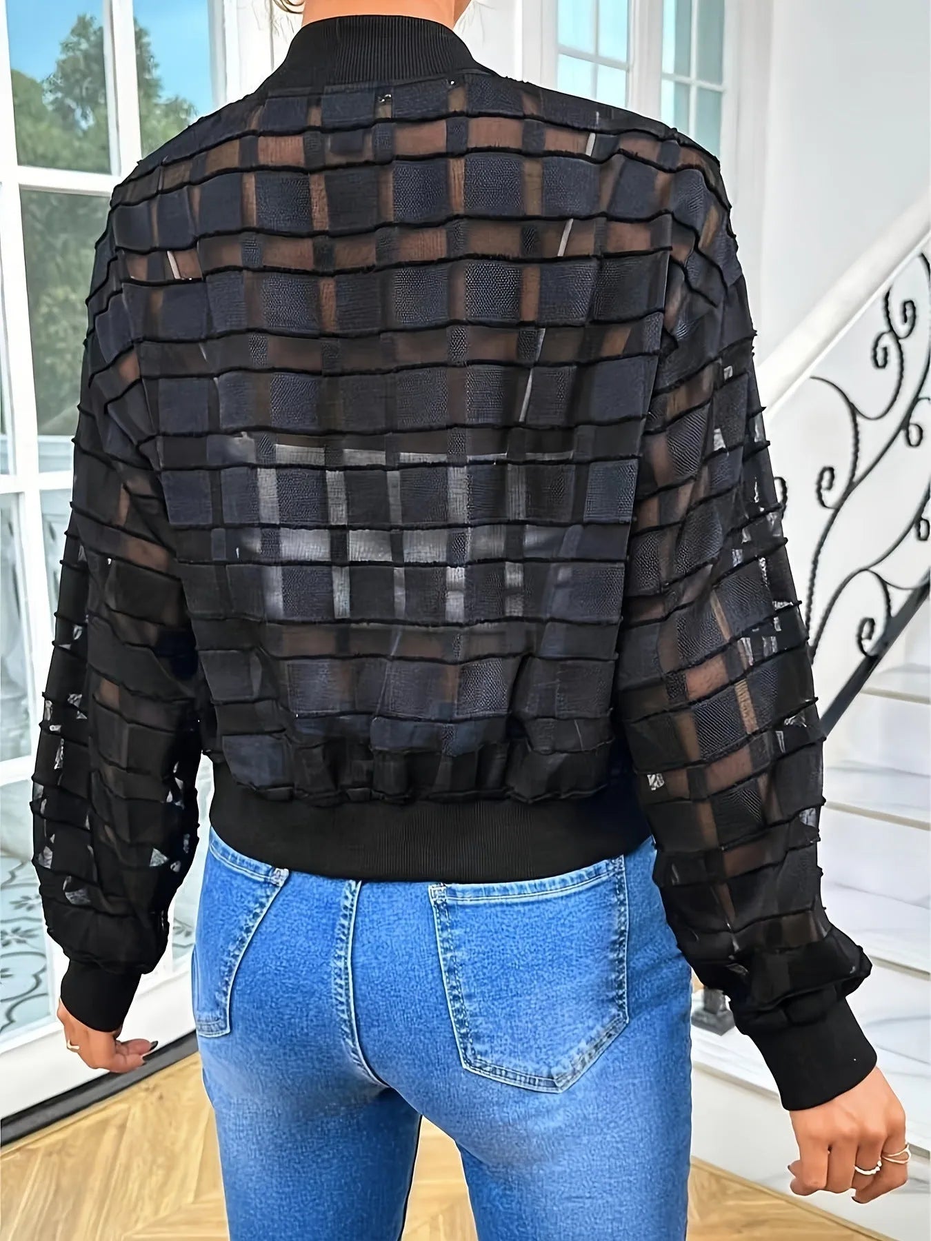 Black women's jacket with geometric pattern and front zipper