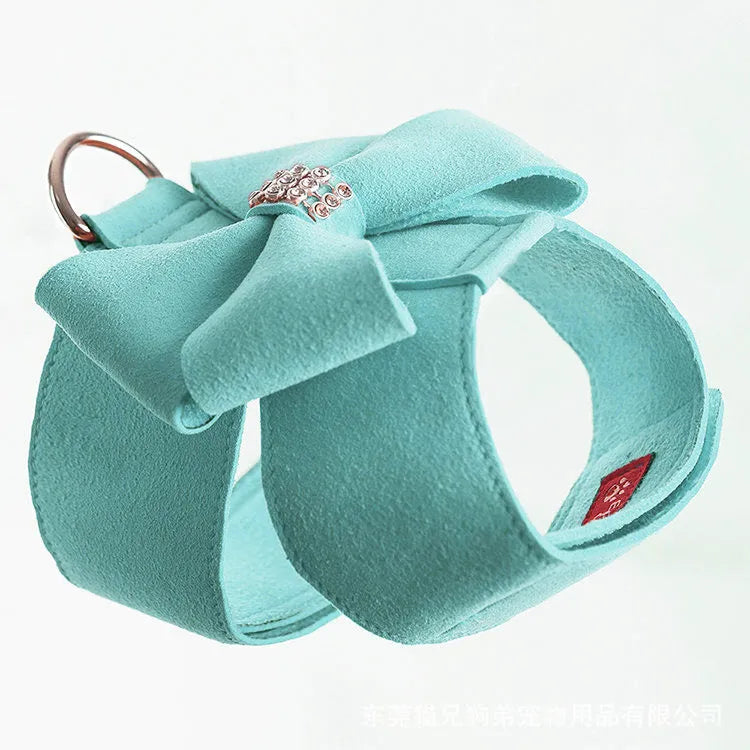Pink microfiber dog chest strap with a bowknot, showing the harness design.