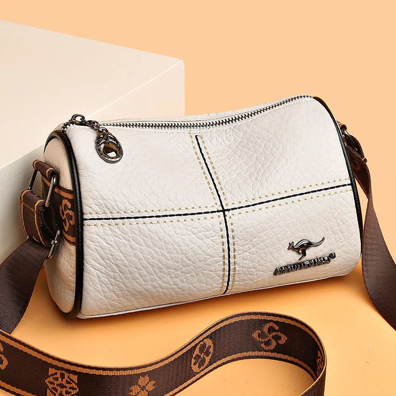 Genuine leather women's cylindrical shoulder bag with stitched patchwork, zip pocket, phone pocket and document pocket