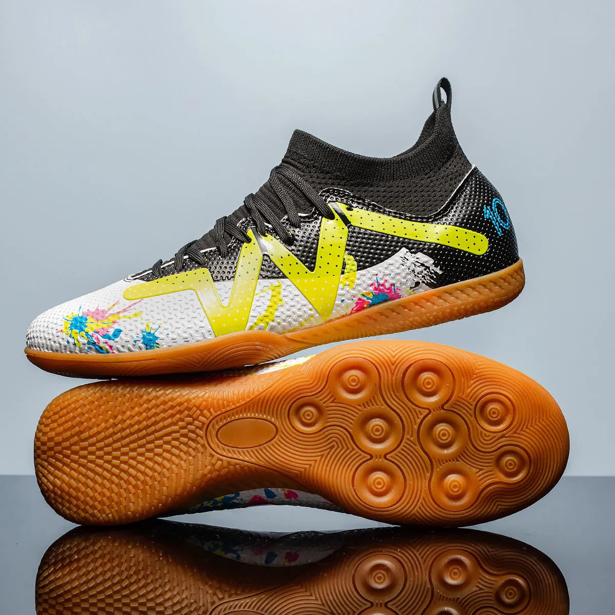 Low-top football boots with replaceable rubber studs on a non-slip sole, in Black and Yellow colourway.