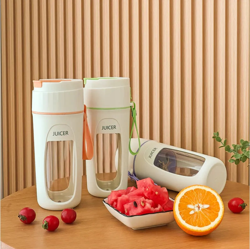 Portable USB rechargeable blender with borosilicate glass cup in fresh orange, grass green, and light purple colours.
